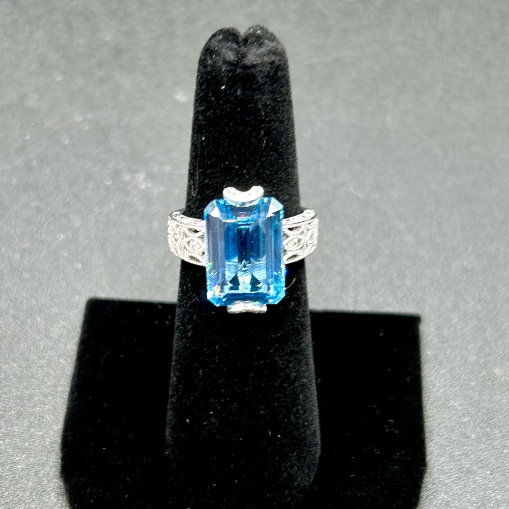 Tacori London Blue emerald cut with Domonique simulated diamonds around. Size 6